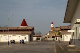 Fishing-harbour,-Lighthouse,-British-colonial-architecture,-Fort-James,-Harbour-esplanade,-Red-rooftop,-Cargo-tricycle,-Harbour-life,-Urban-rehabilitation,-Victorian-era,-Jamestown,-Accra,-Ghana,-West-Africa